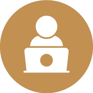 Icon of a person using a laptop, depicted in white on a brown circular background.