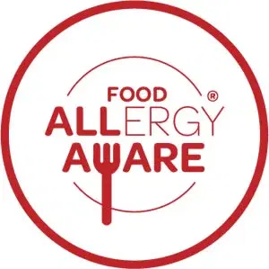 Red circle logo with text "Food Allergy Aware" and a fork symbol, emphasising awareness of food allergies.