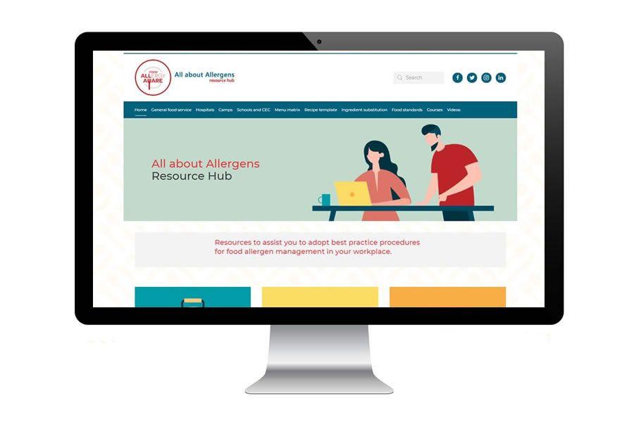 Computer screen displaying a website titled "All about Allergens Resource Hub" with illustrations of two people working at a desk.
